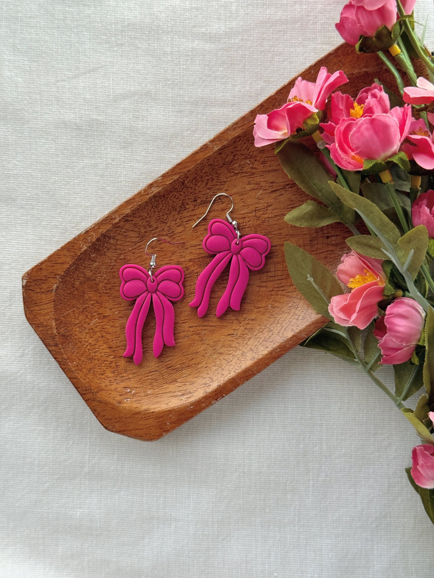 Fuchsia Bow Clay Earrings
